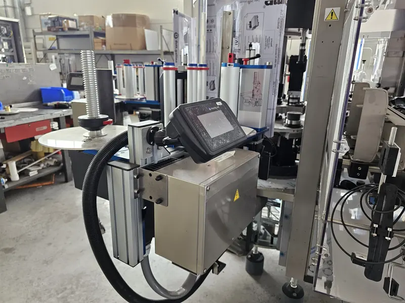 Photo #9 of automatic rotary adhesive labeler with modular optical centering